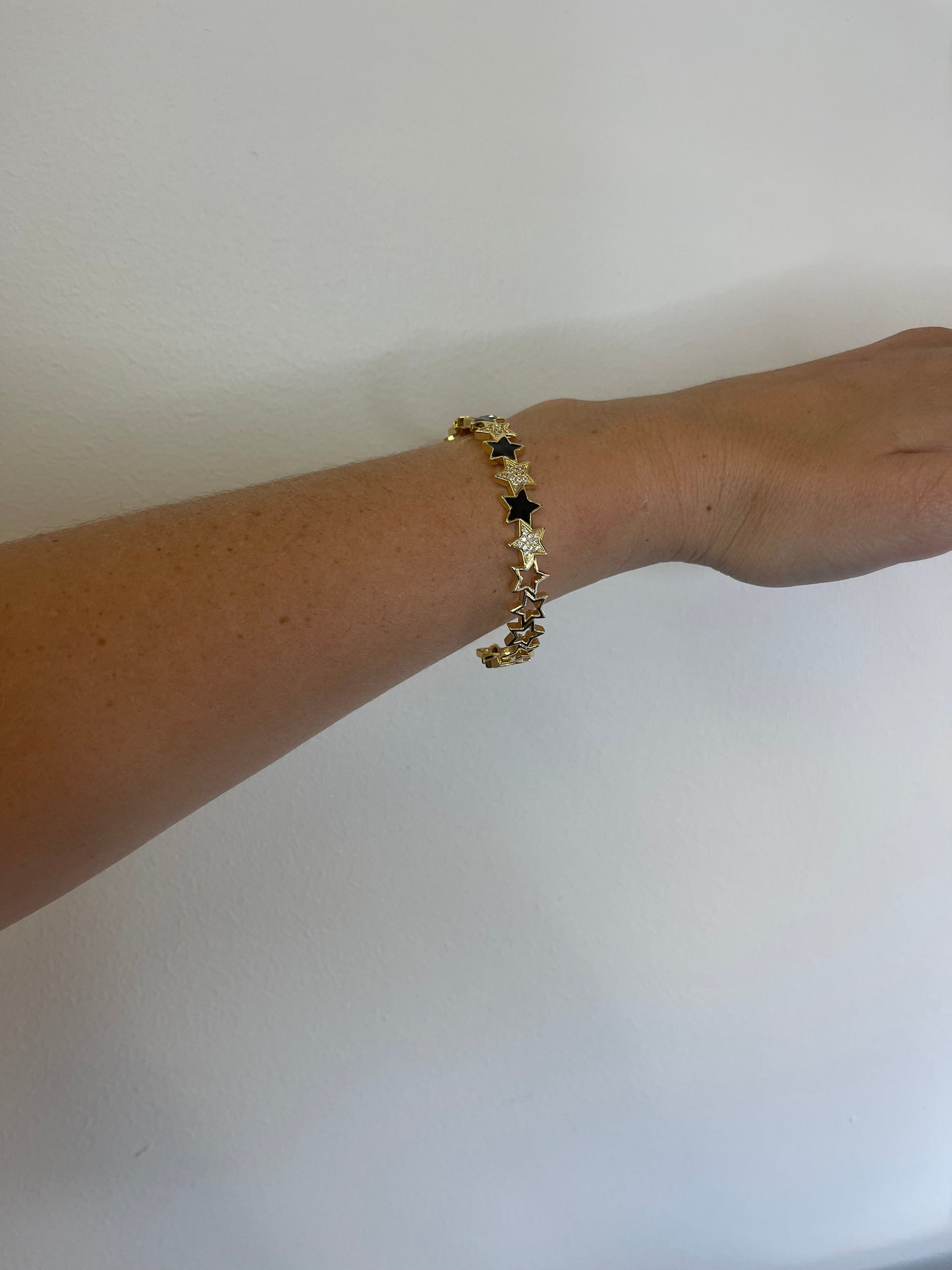BLACK AND GOLD STAR BRACELET